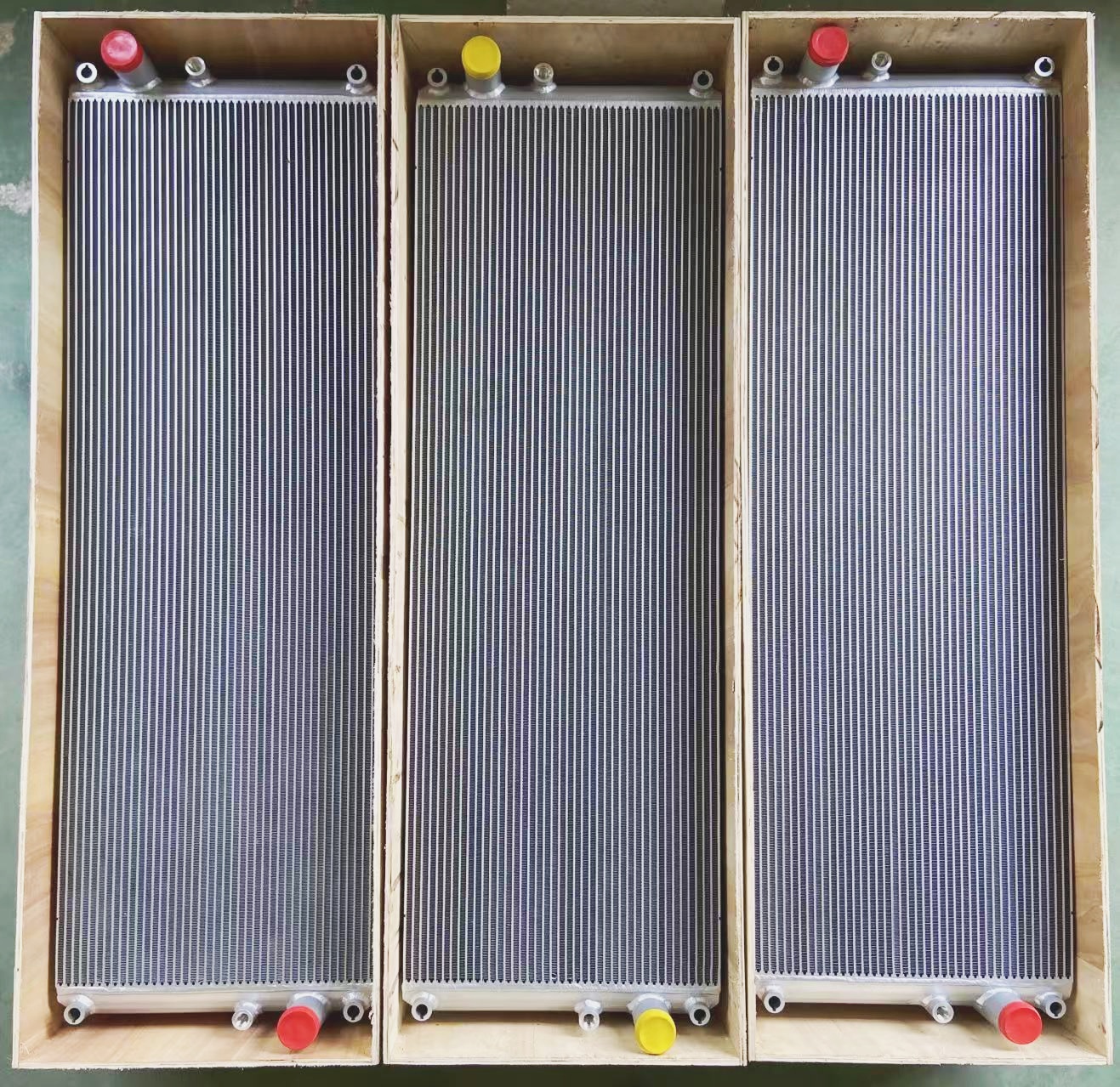 Dual aluminum intercooler cores mounted in wooden frame for shipment