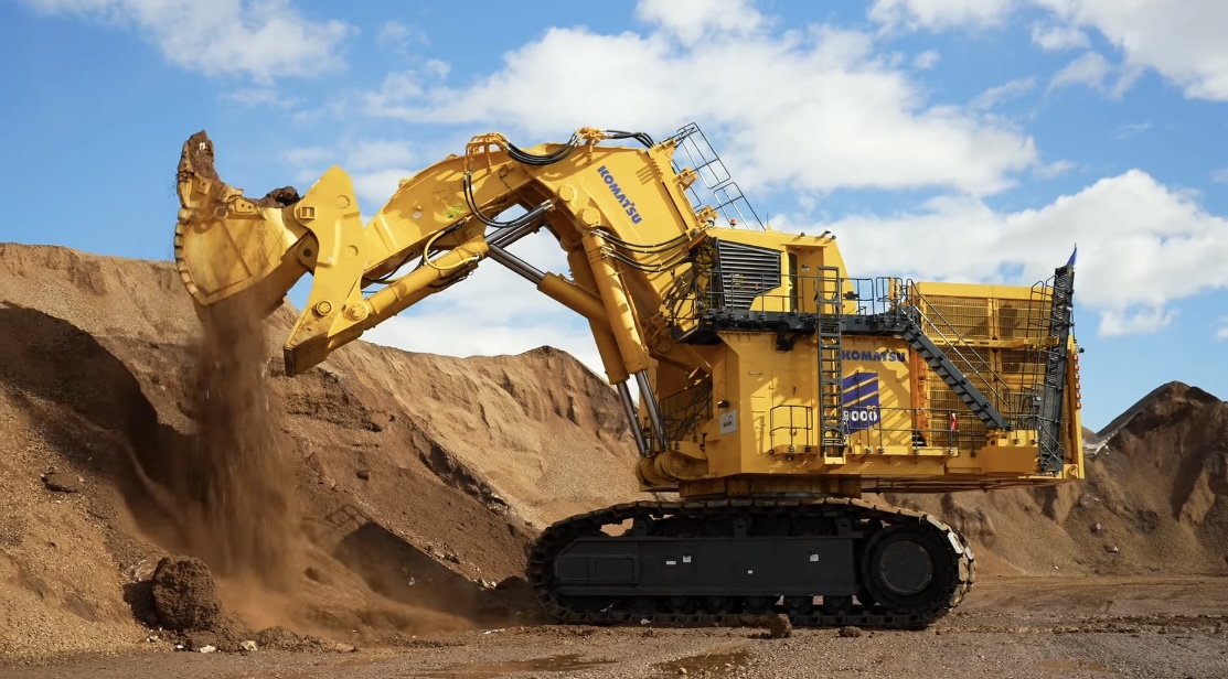 Komatsu PC9000 mining excavator side view operating in open-pit site