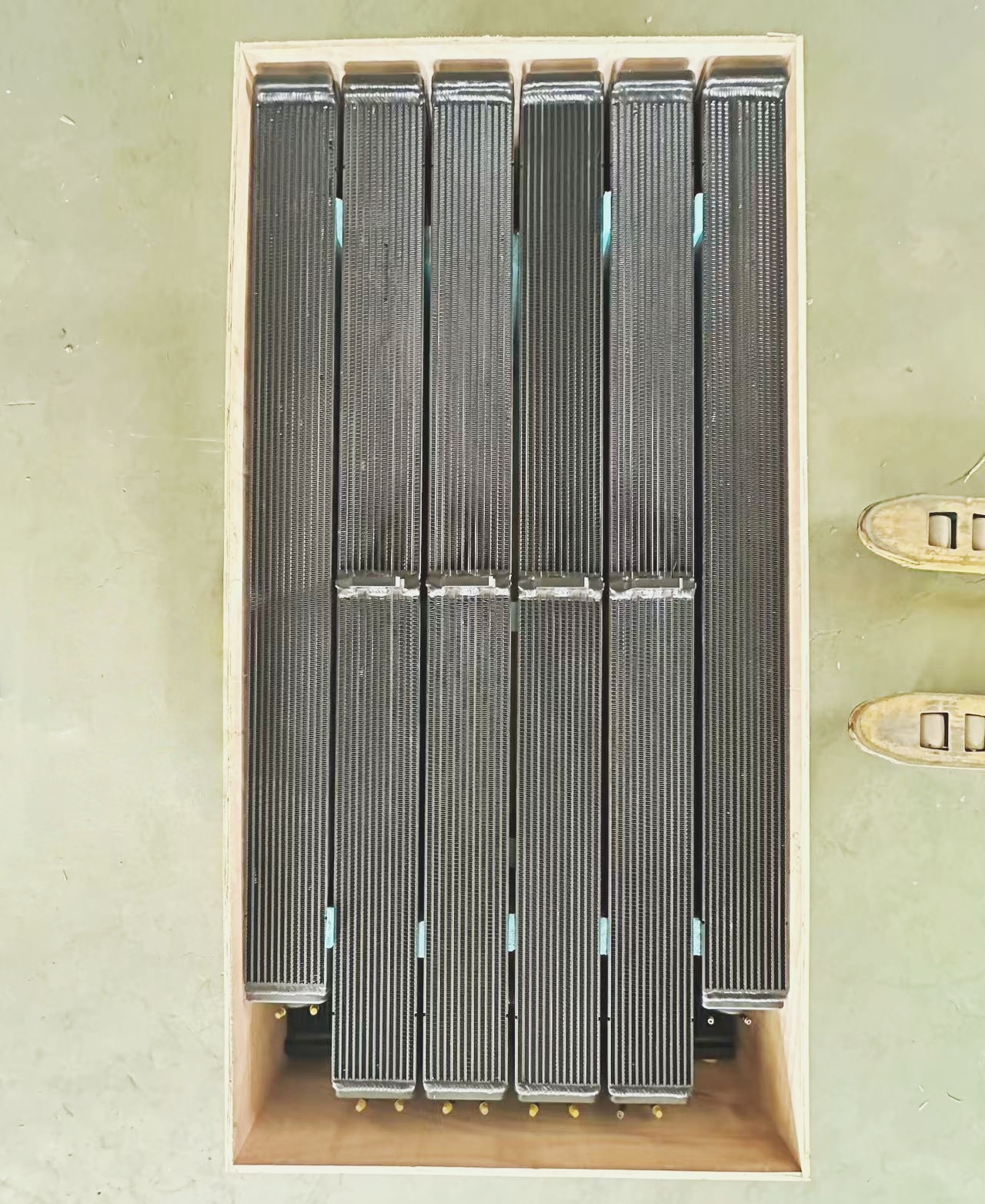 Vertical aluminum radiator core showing parallel fin-tube design