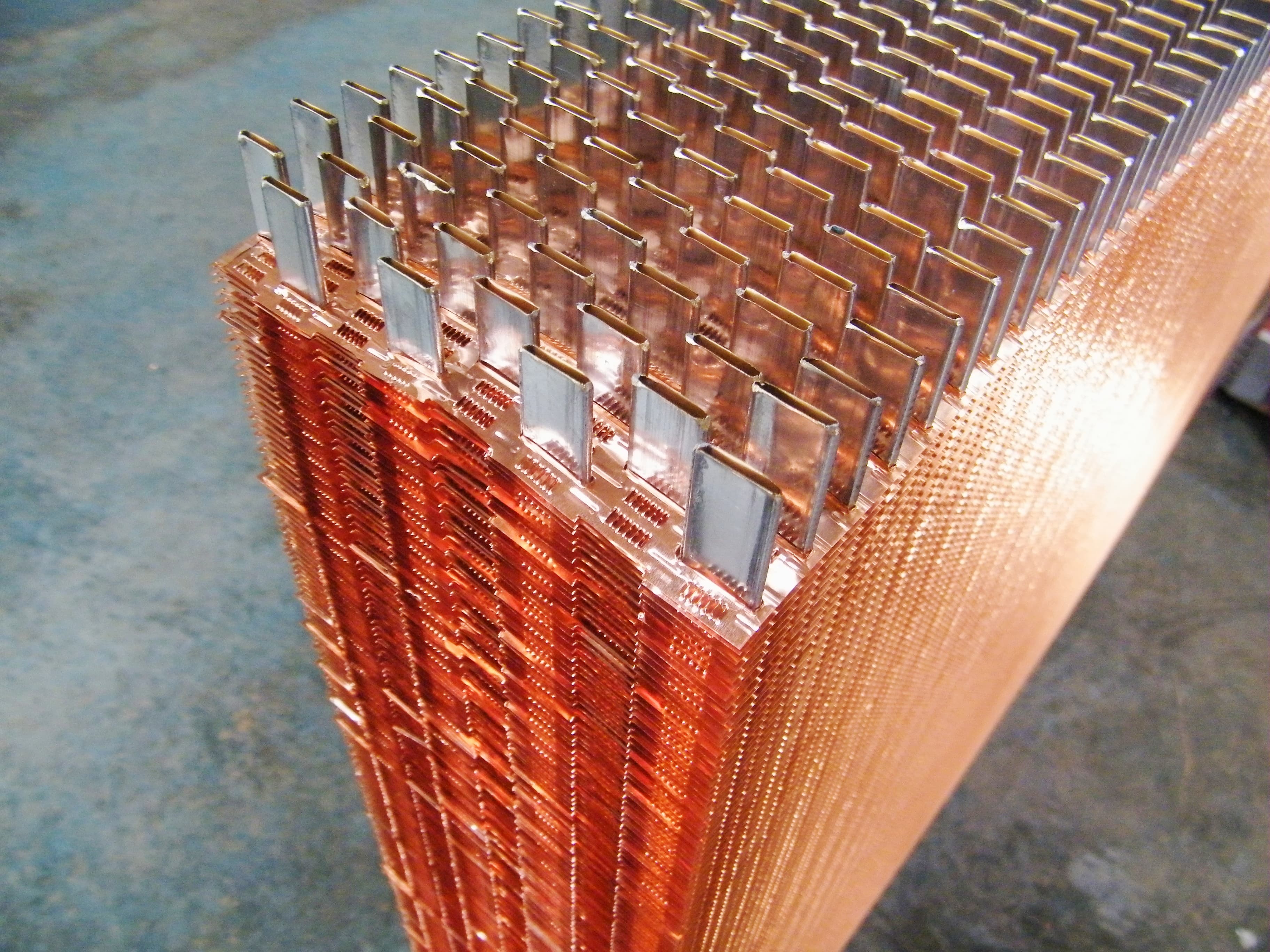 Close-up of copper fin tubes for generator radiator assembly