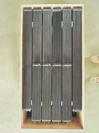 Vertical aluminum radiator core showing parallel fin-tube design
