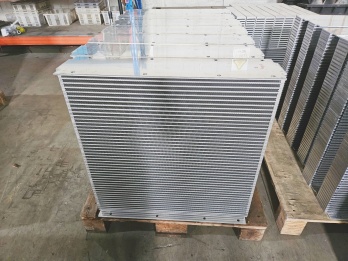 Stacked aluminum radiator fins packed in bundles for radiator assembly