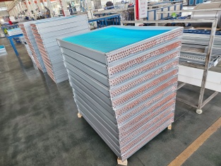 Anti-corrosion coated condenser coil modules stacked in workshop