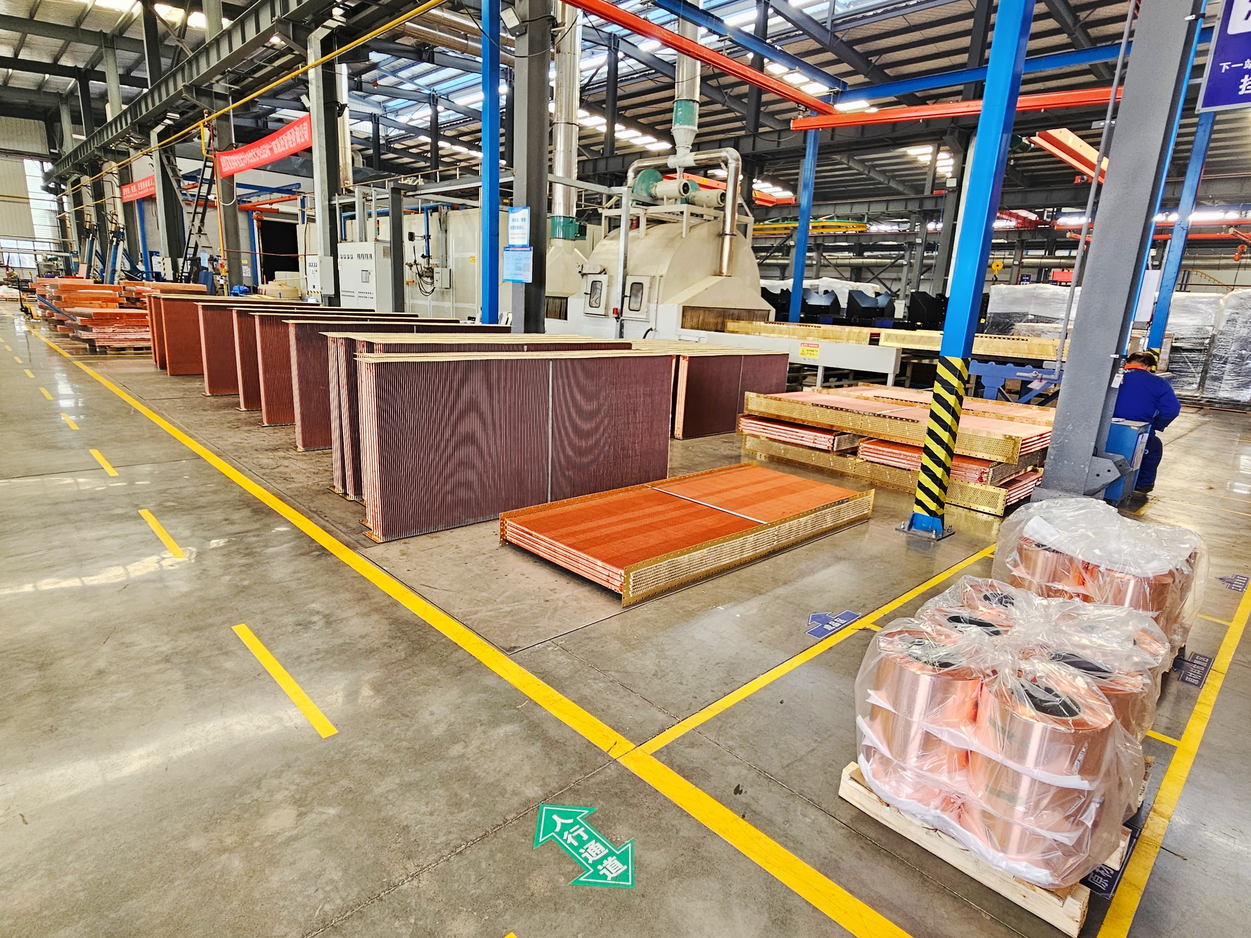 Copper fin-tube radiator cores stored in Sinrui workshop
